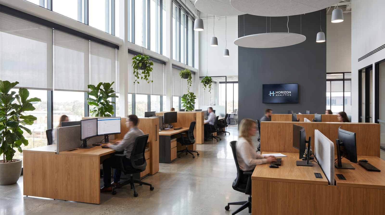 Modern open-plan office with biophilic design, sound masking, and digital signage